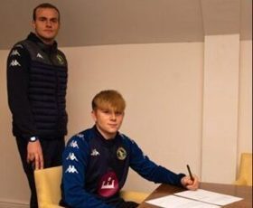 Joe Taylor signing his first team contract